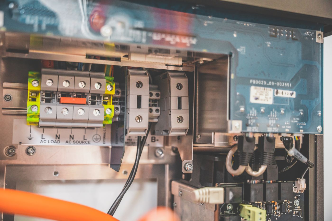 Technician working on a wall-mounted hybrid inverter