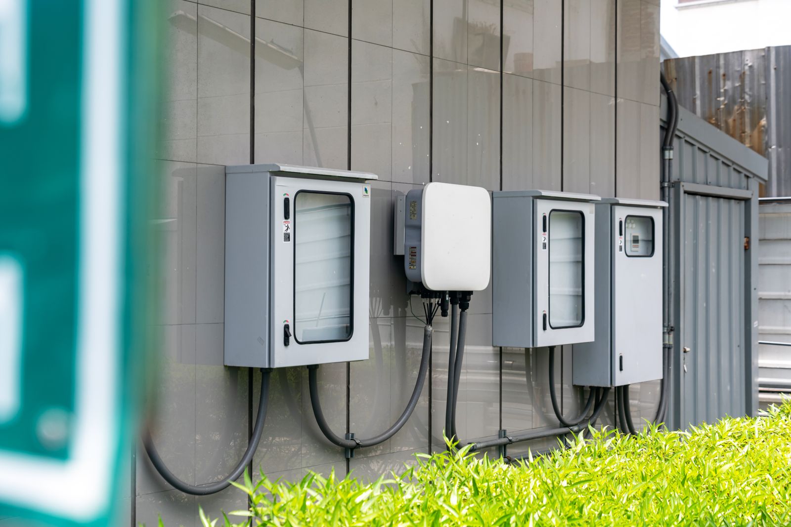 Wall-mounted power conversion and battery storage cabinets